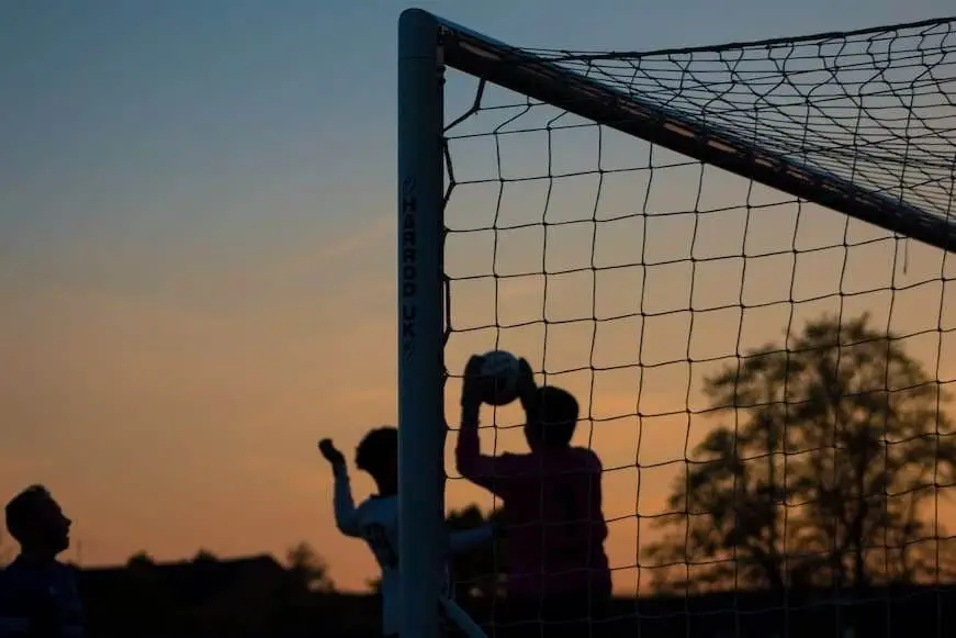 What Does FT Mean in Soccer? People play soccer during the evening time.