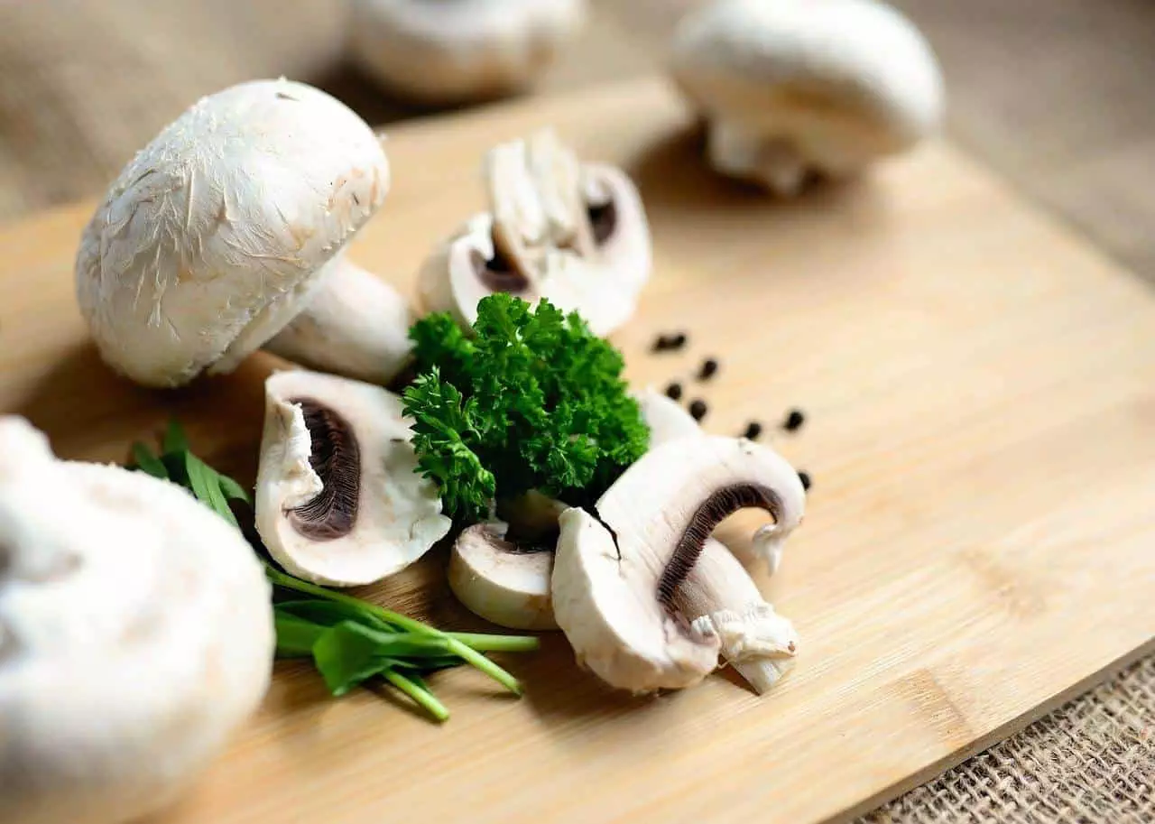 White mushrooms with some green vegetables