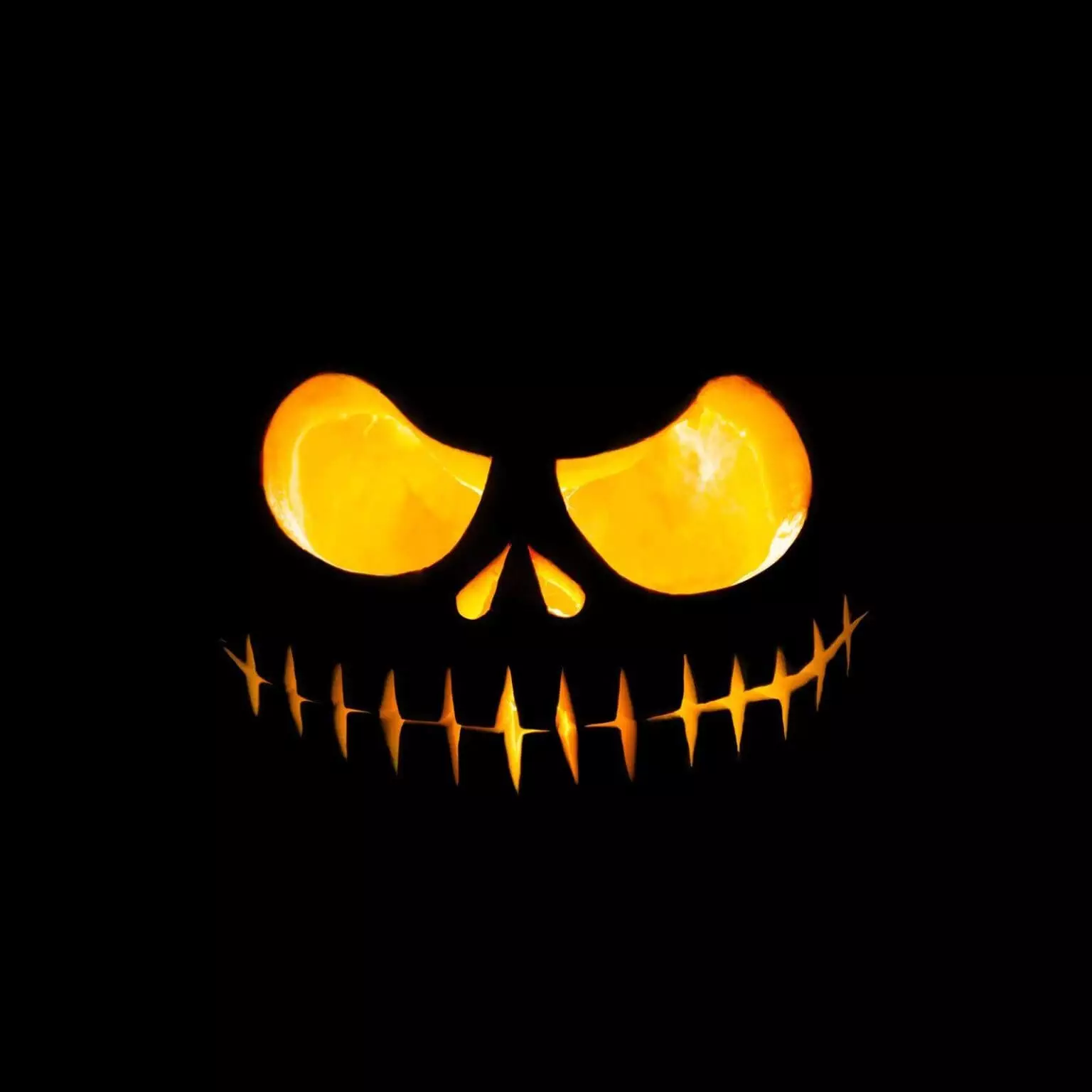 39025132 close up view of scary halloween pumpkin with eyes glowing inside