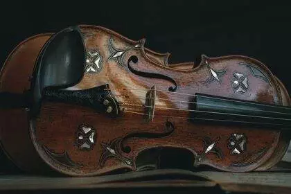 A close-up of a violin with a design made on it.