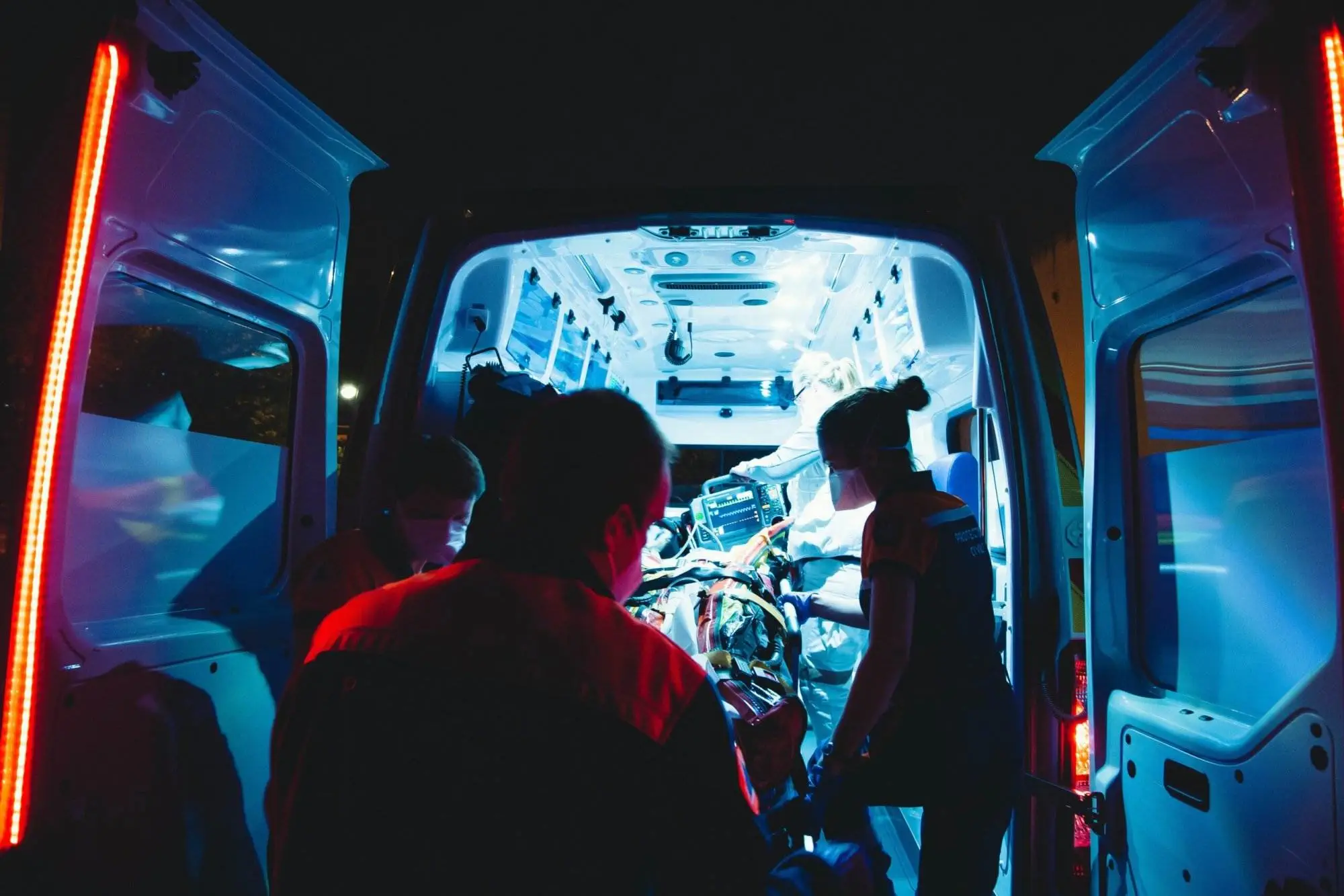 How to Claim for Health Insurance in Canada? Few paramedics taking someone into the ambulance.