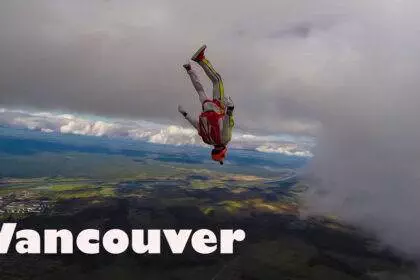A person in the air during the Vancouver skydiving experience.