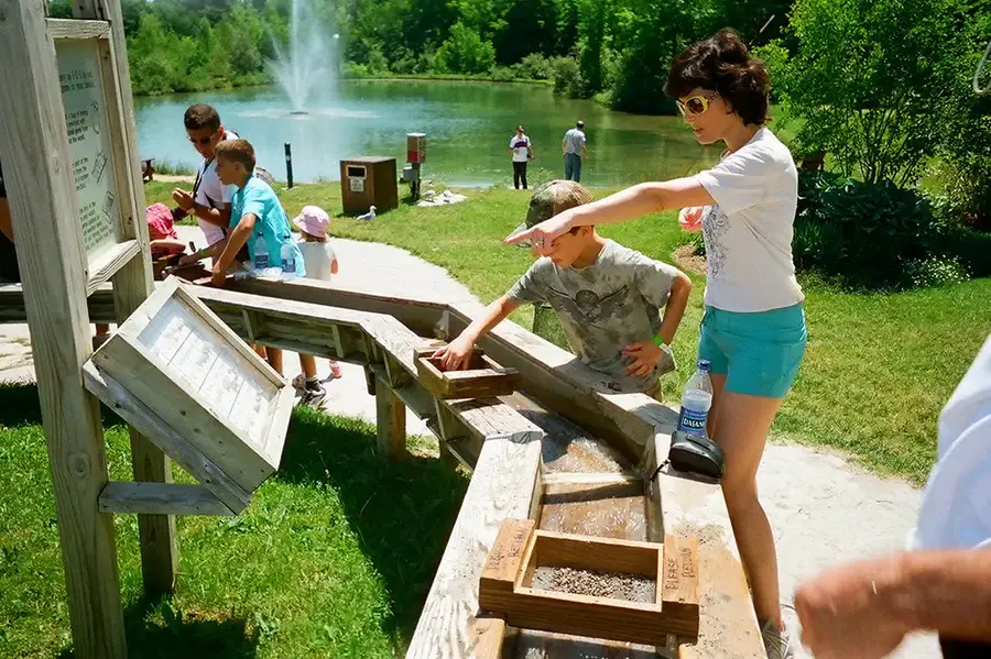 Everything You Can Do at the Blue Mountains Scenic Caves? People near a waterbody in the Blue Mountains Scenic Caves