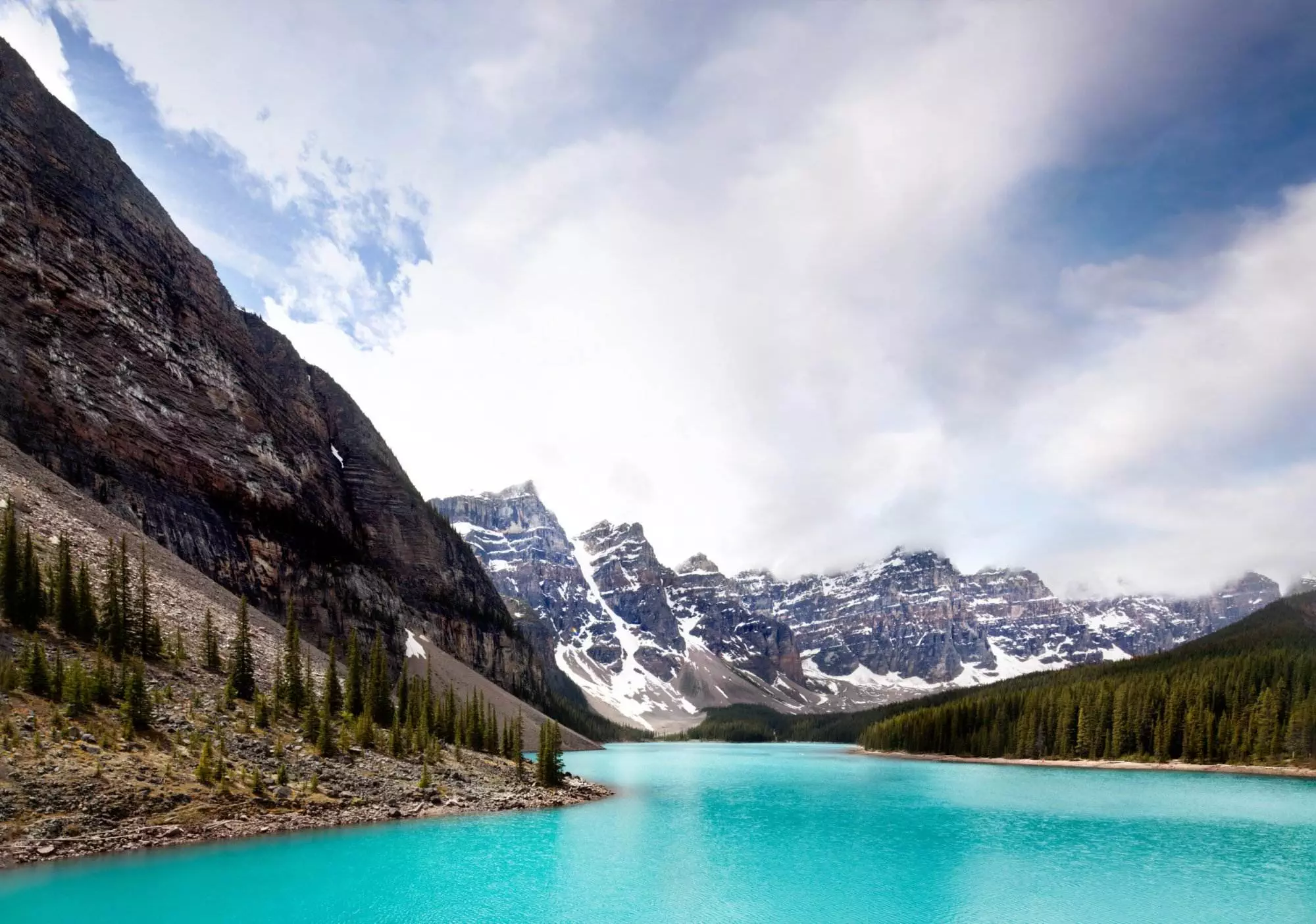 Landscape view of the Moraine Lake with mountains and turquoise waterbody in Banff National Park in Canada