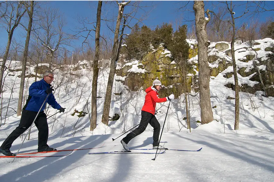 Everything You Can Do at the Blue Mountains Scenic Caves? People skiing on snowy ground in the Blue Mountains Scenic Caves.