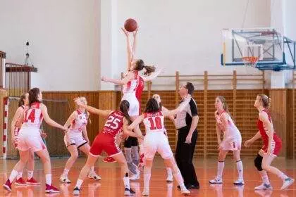 A group of women playing basketball game