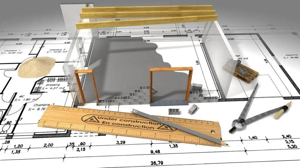 Is a Graphic Design Degree Worth It a view of designing a house with maps, rulers and a miniature building construction.