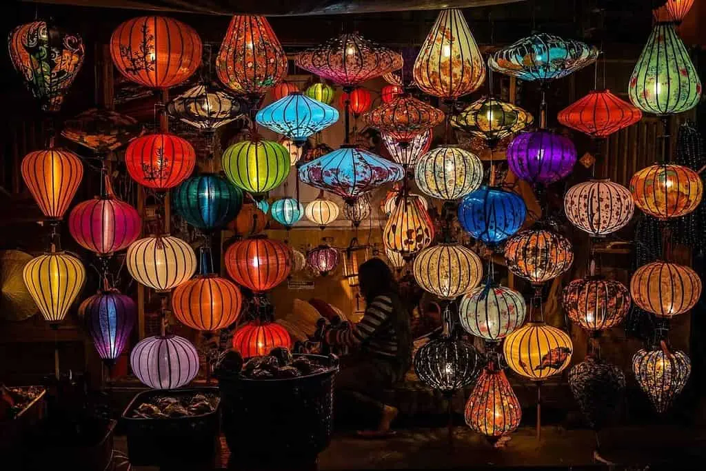 13 Amazing Things to Buy in Morocco many multi-coloured lanterns displayed in a shop.