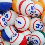 A filled background of many bingo balls from all colors.