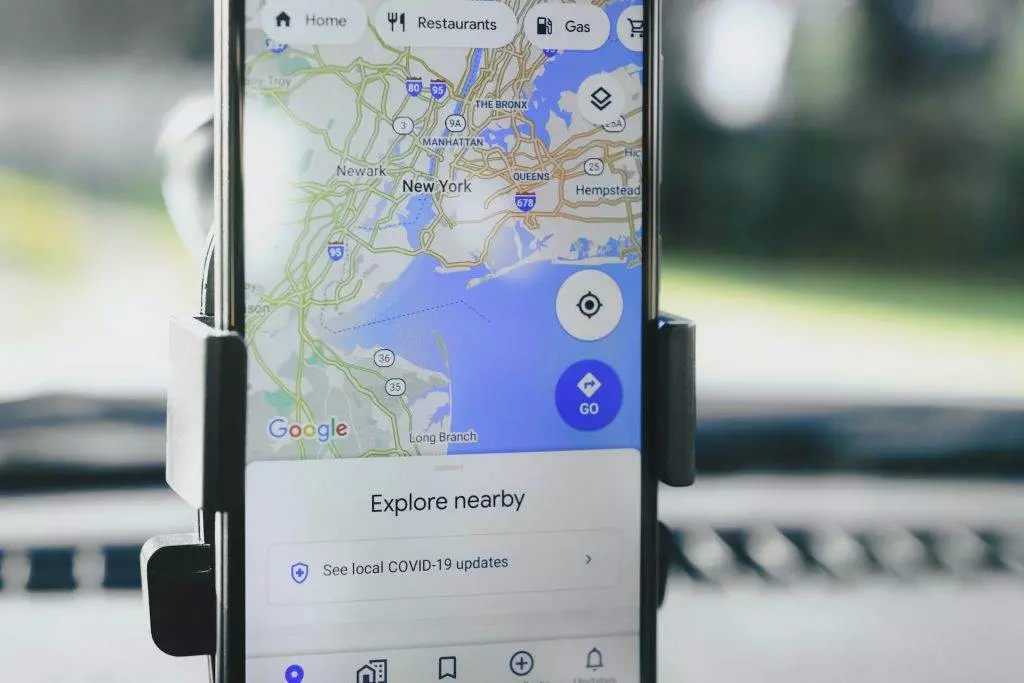 A phone with the google map opened on the screen for the geographic target.